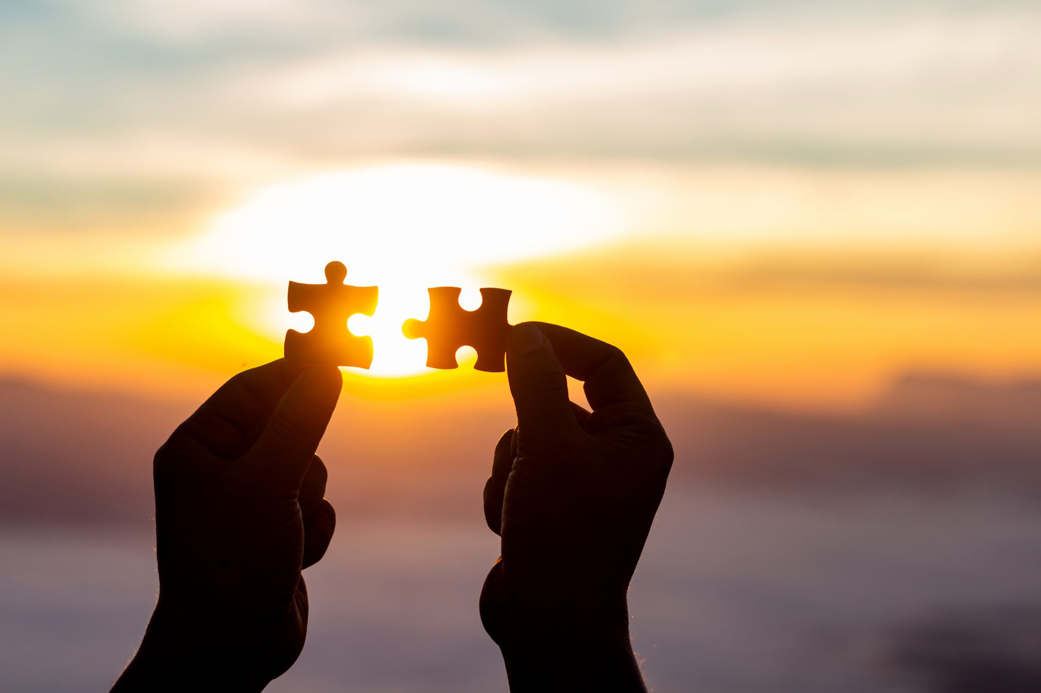 putting two puzzle pieces together