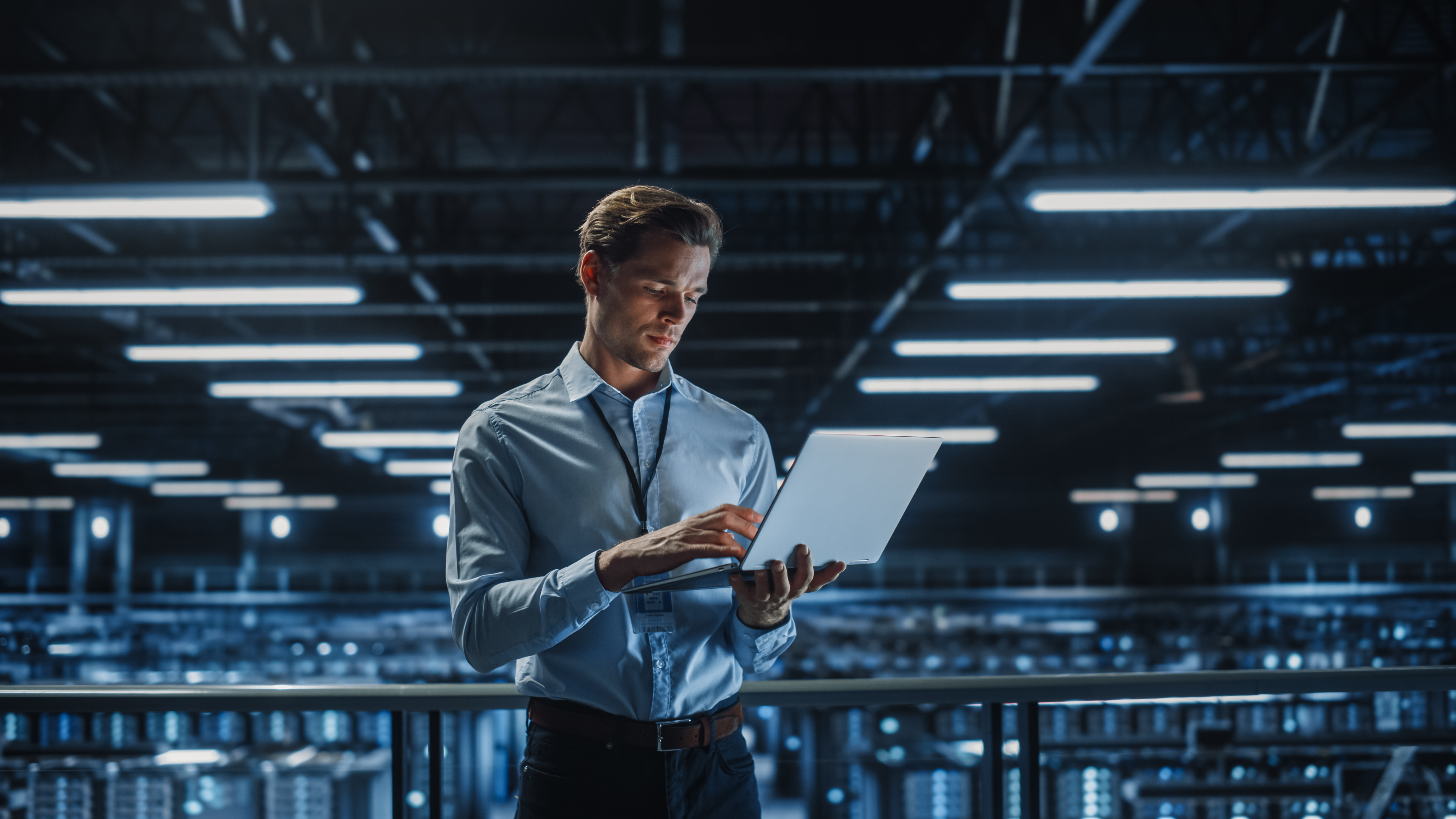 Man looking at computer. Maybe he's thinking about how to build an AI model.