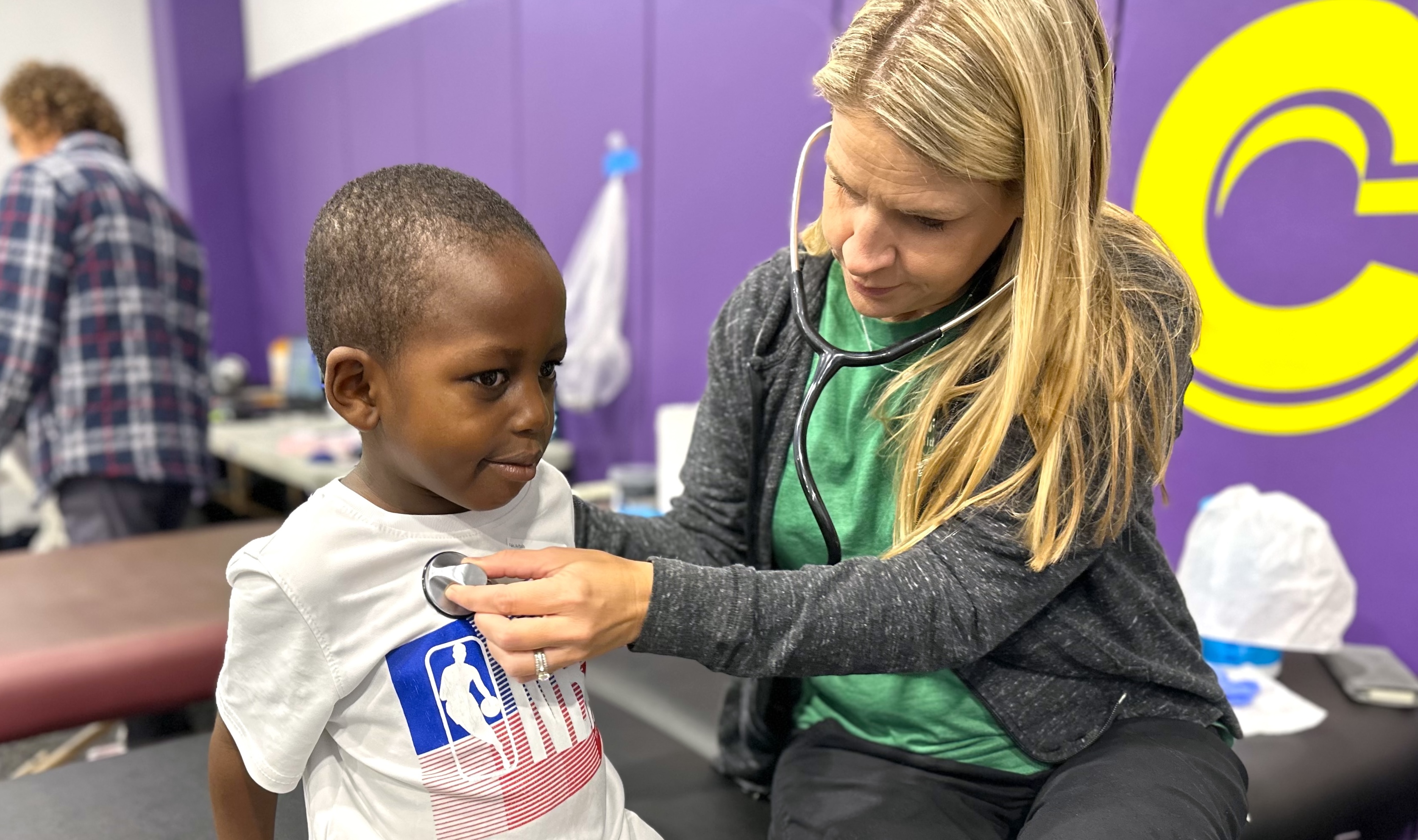Child receives care at a school wellness screening