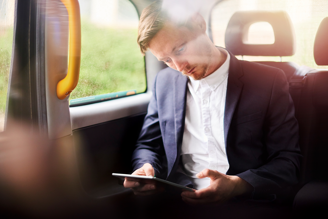 OUniversity learning on the go | Stock man with tablet on bus 