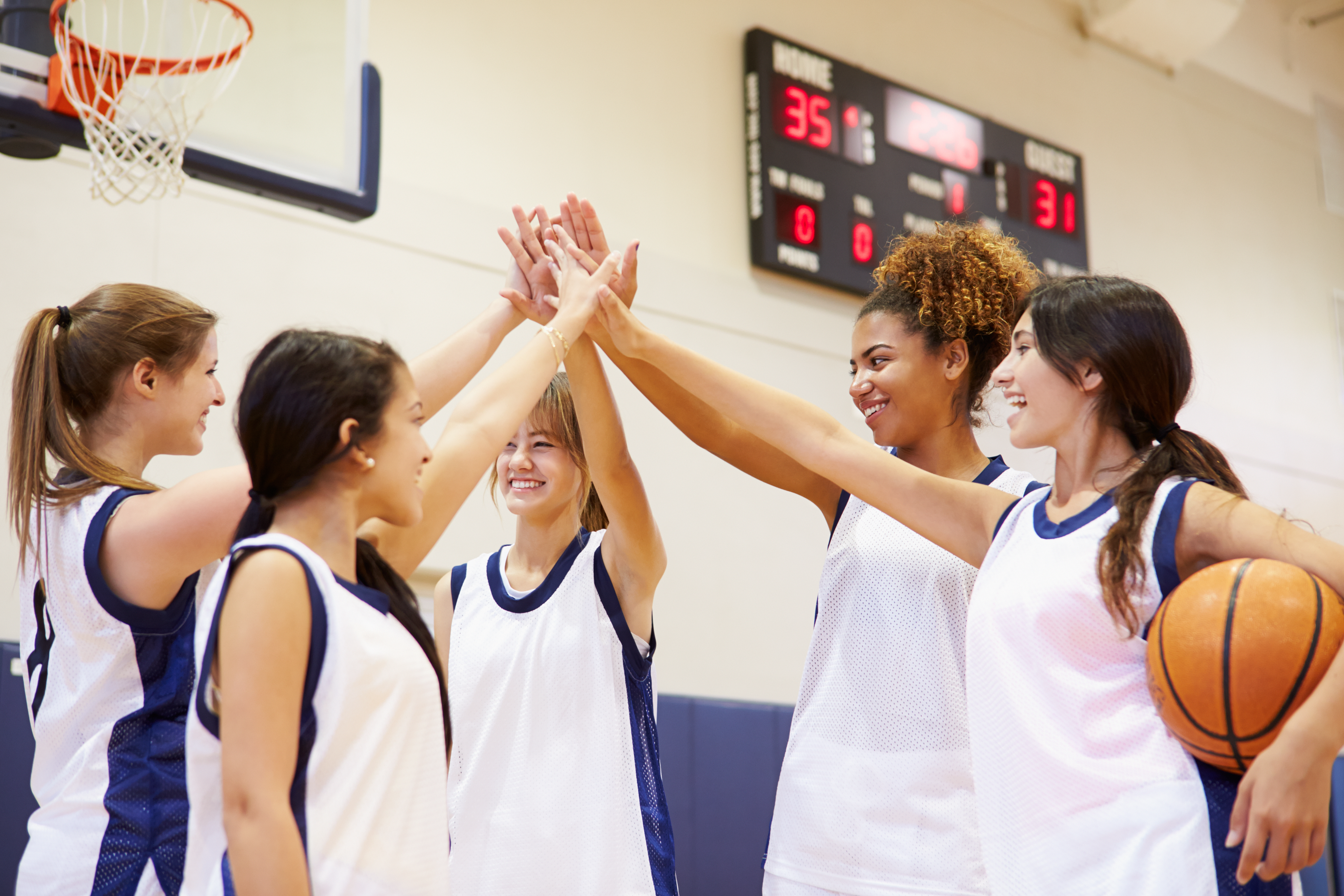 Teamwork on girl's basketball team