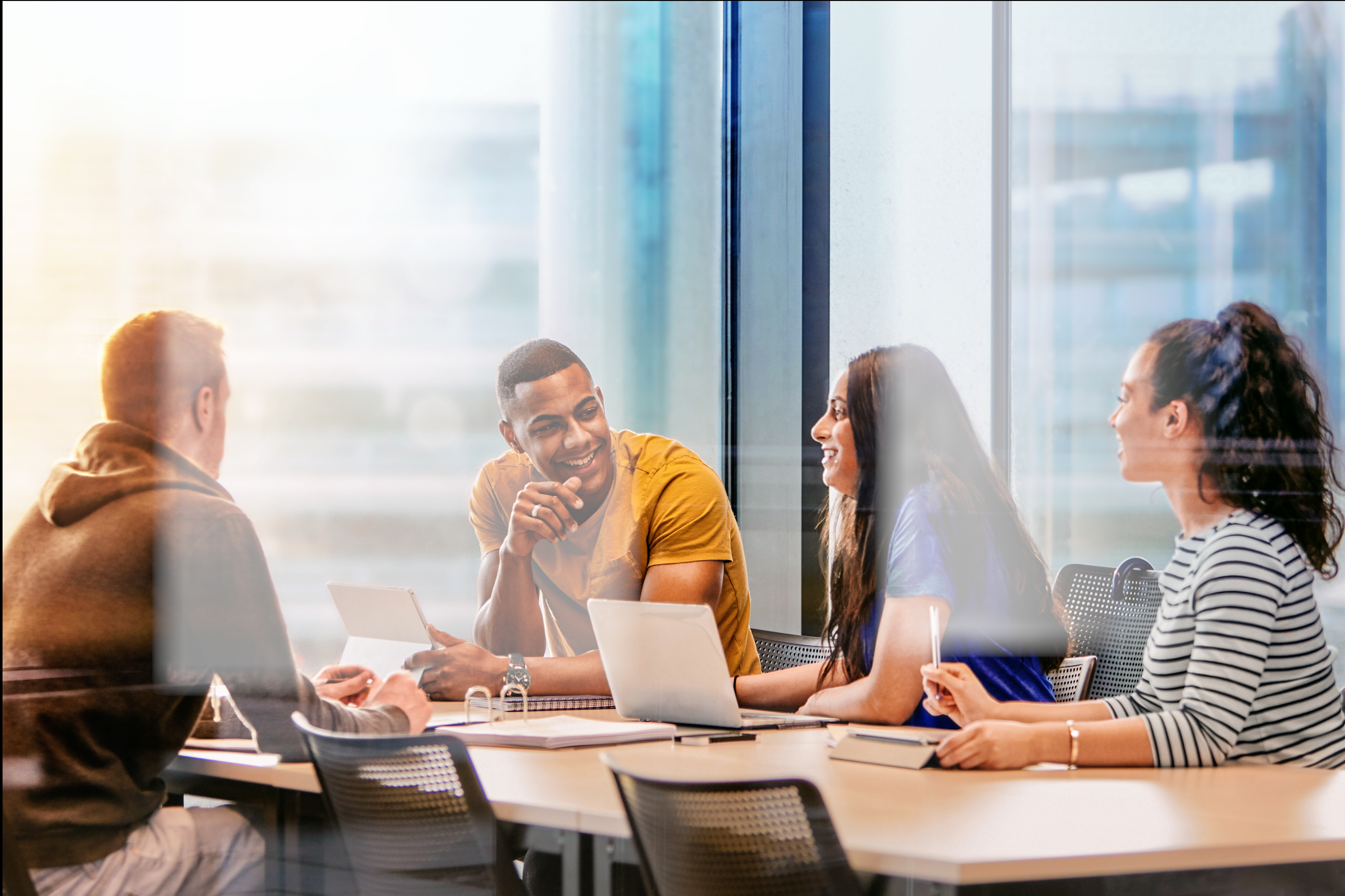 A group of people working around a table