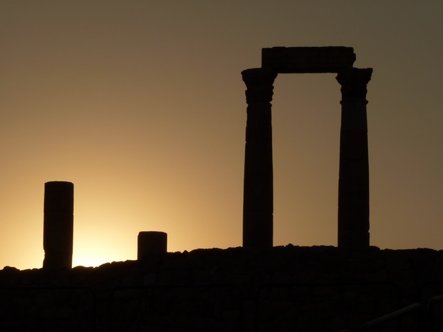 Columns silhouetted by sunrise
