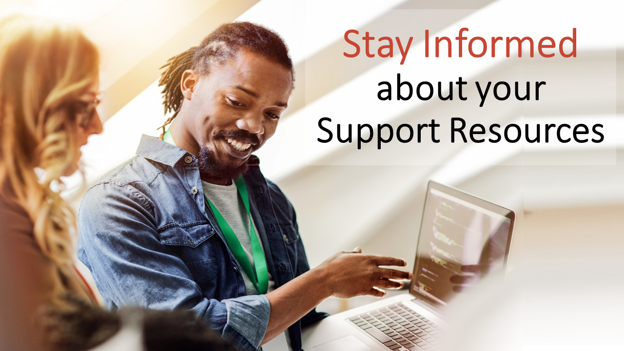 Woman and Man looking at a laptop