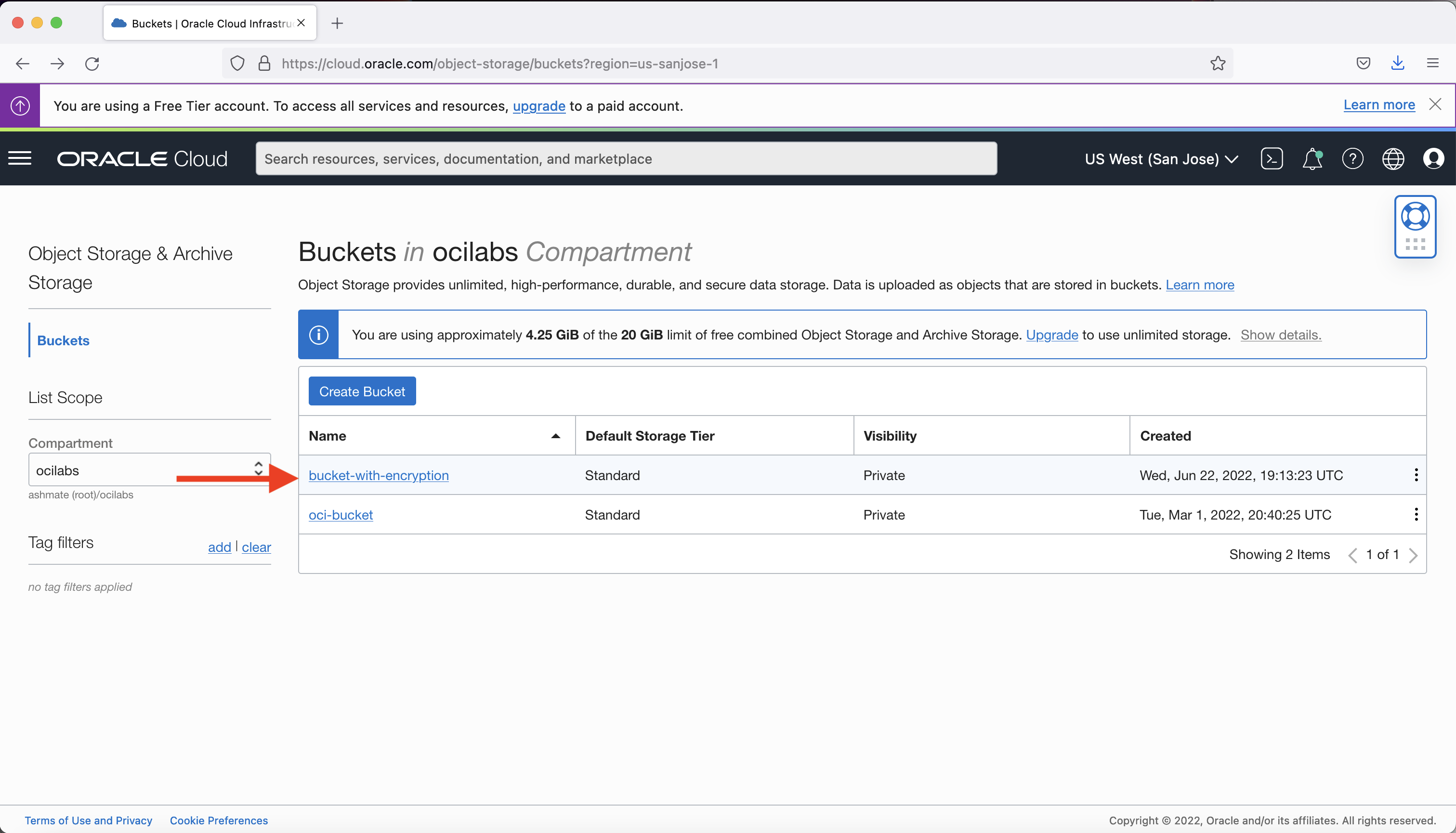 A screenshot of the Buckets page with a red arrow pointed to the bucket-with-encryption bucket.