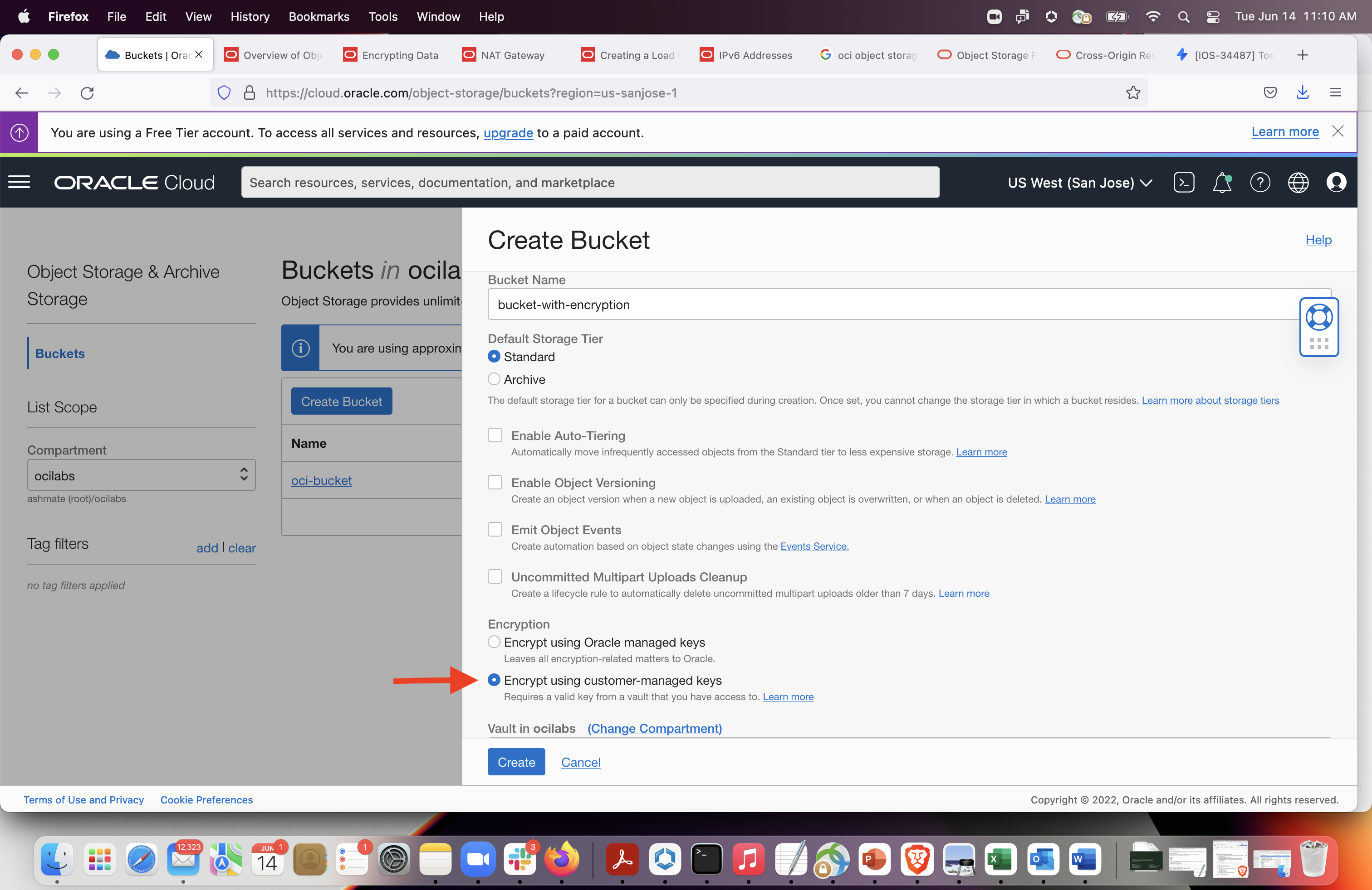 A screenshot of the Create Bucket window with a red arrow pointing to the option to encrypt using customer-managed keys.