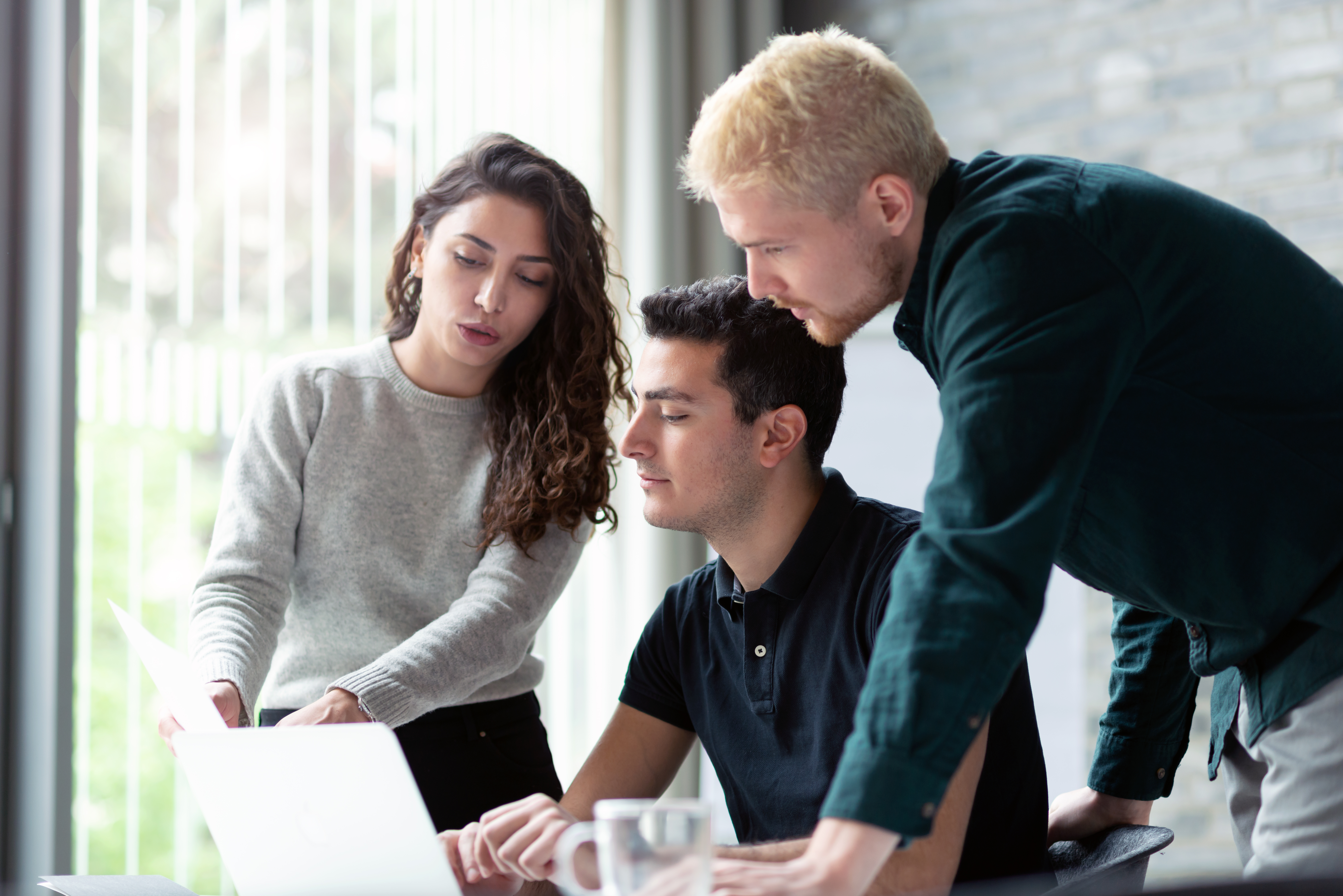 Three people discussing serverless Kubernetes costs