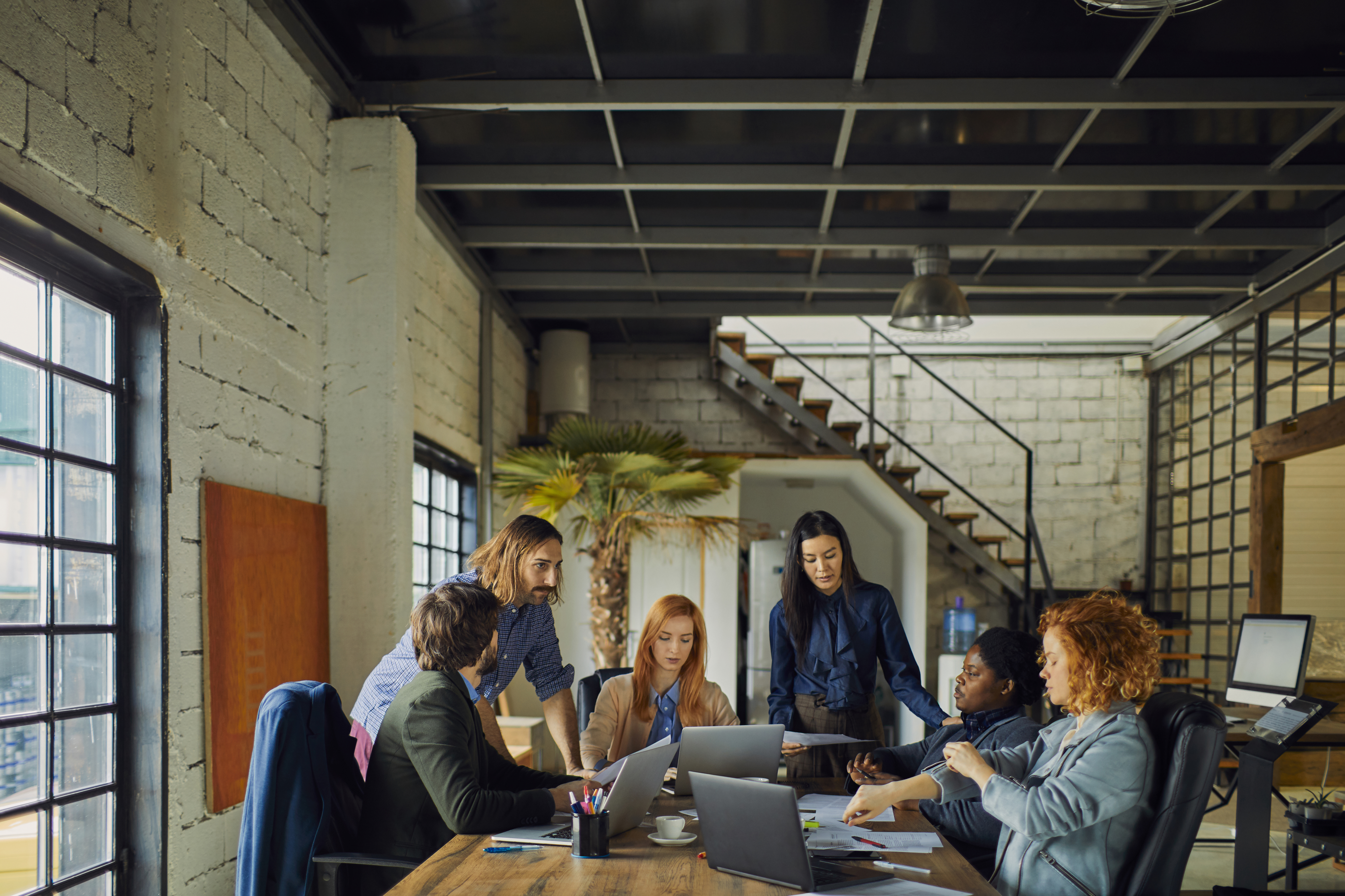 Colleagues collaborating in urban loft